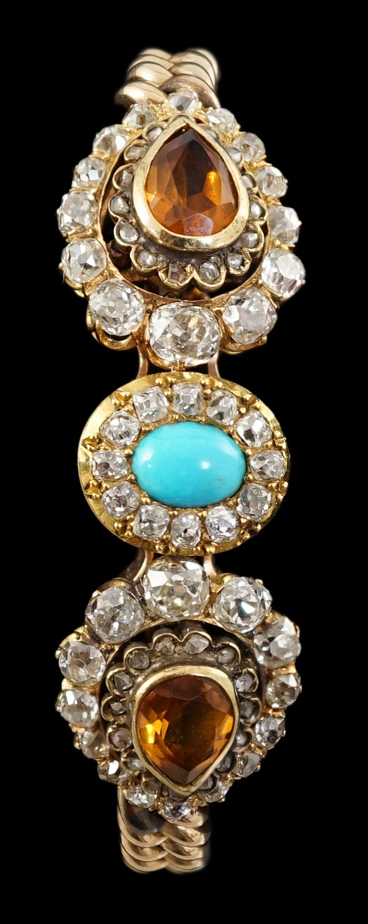 An Edwardian 15ct gold, citrine, turquoise and diamond set triple cluster set curblink bracelet